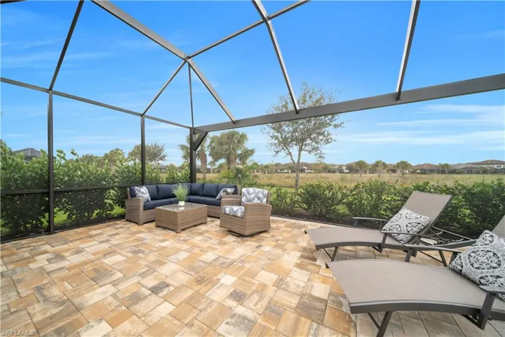 View of patio / terrace with glass enclosure and a sunroom