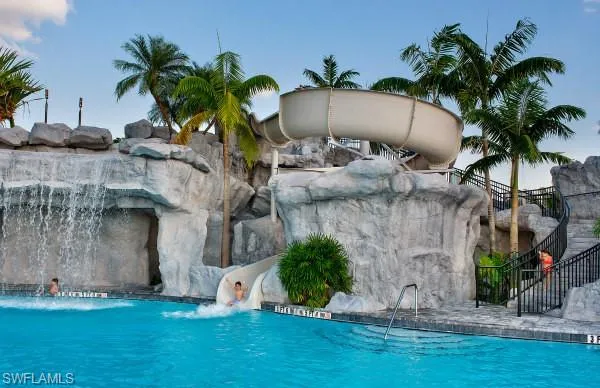 Community pool featuring a water slide