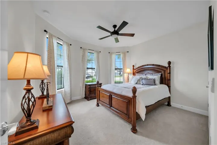 Bedroom with carpet flooring and a ceiling fan