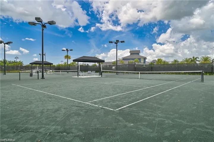 View of tennis court featuring a gazebo