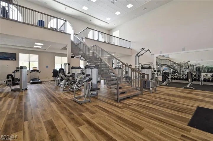 Workout area featuring a high ceiling
