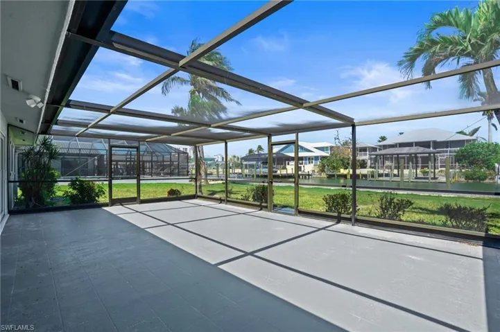 Patio with screened in lanai. Virtually edited photo.