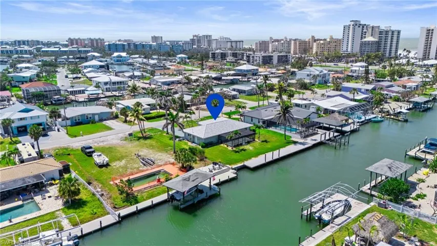 Drone / aerial view with a water view   - Virtually Edited Imageand a city view.