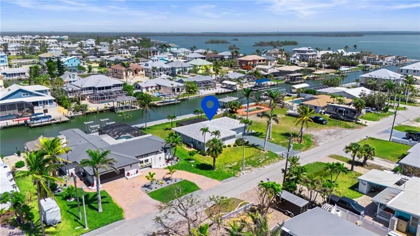 Drone / aerial view with a water view and a residential view  - Virtually Edited Image.