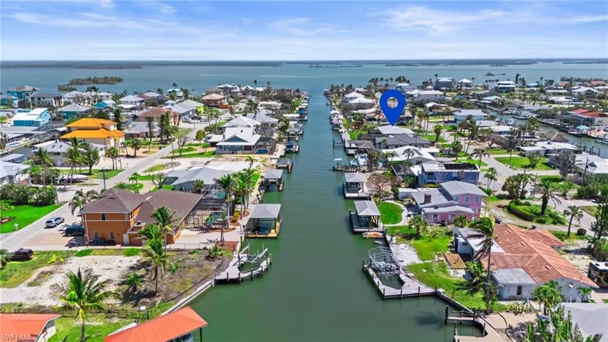 Drone / aerial view with a water view and a residential view  - Virtually Edited Image