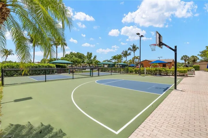 View of sport court featuring community basketball court and fence