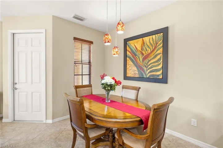 Dining room featuring baseboards and light tile patterned floors