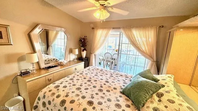 Bedroom featuring a textured ceiling and ceiling fan