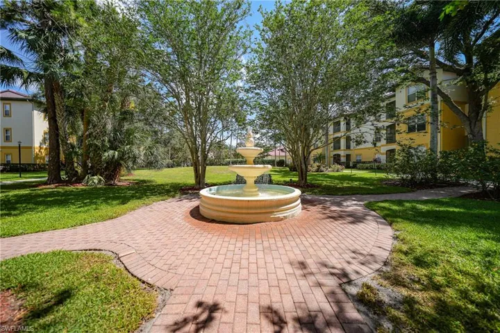 View of property's community with a yard