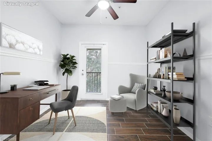 Office space featuring ceiling fan and dark hardwood / wood-style flooring