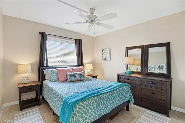 Bedroom featuring a ceiling fan and light tile patterned floors