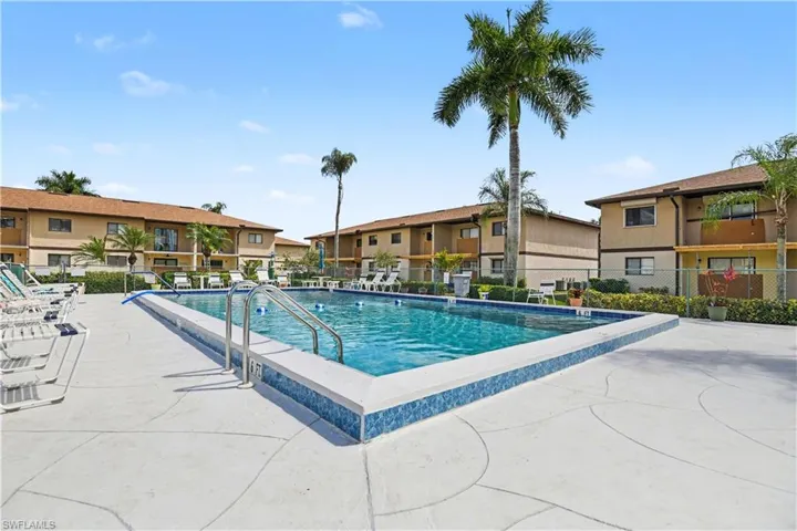Community pool featuring a patio