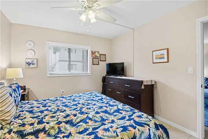 Bedroom featuring baseboards and ceiling fan