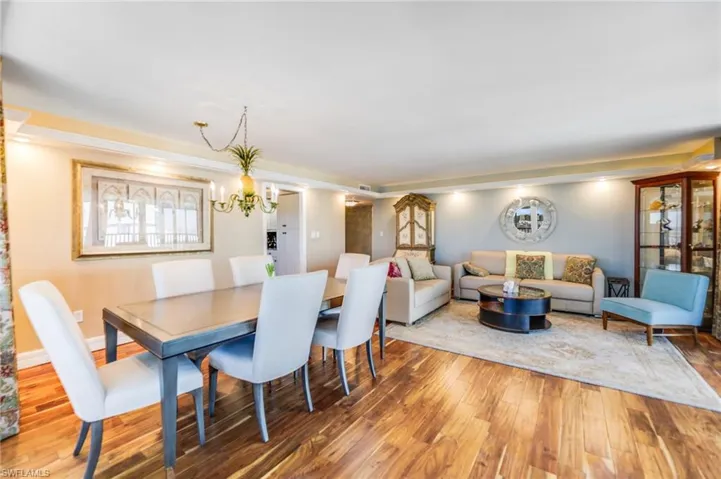 Dining area featuring light wood-type flooring and baseboards