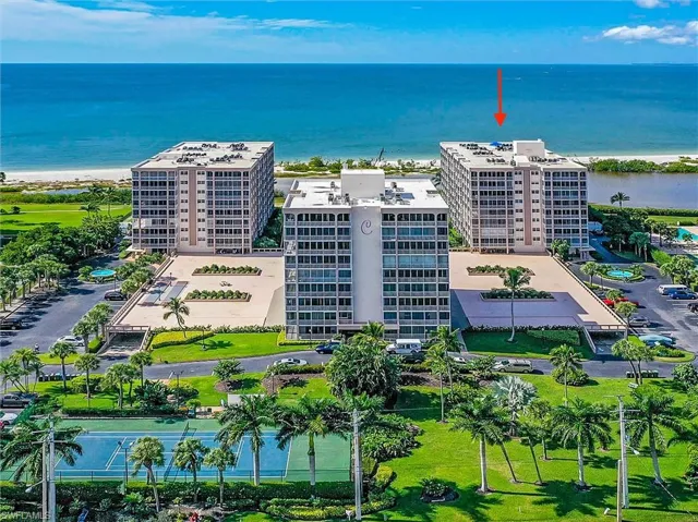 Bird's eye view of apartment complex / building and expansive coastline