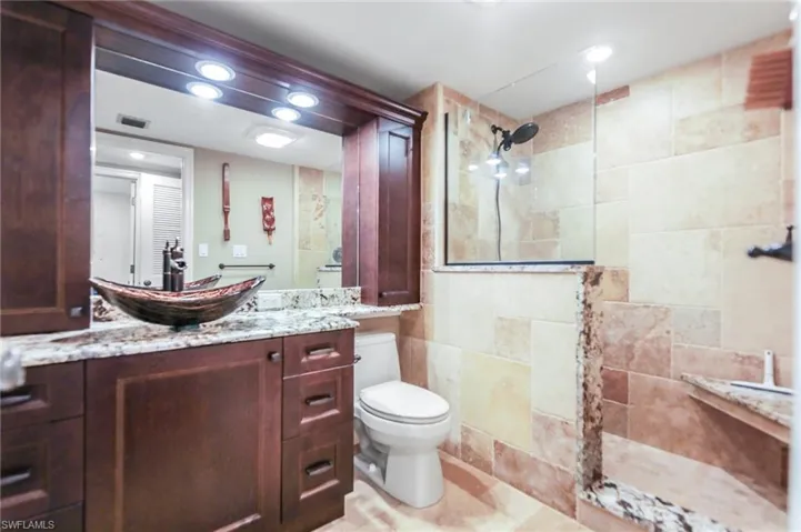 Bathroom with a walk in shower and vanity