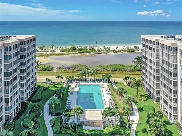 Drone / aerial view of extended coastline and a pool