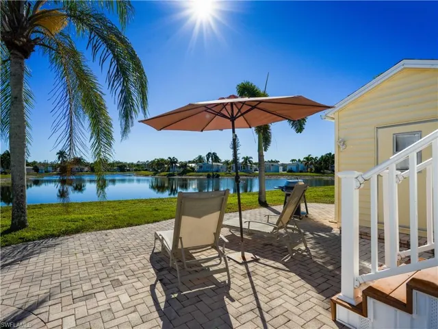View of patio with a water view