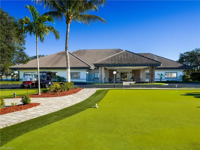 View of home's community featuring a putting area and covered porch