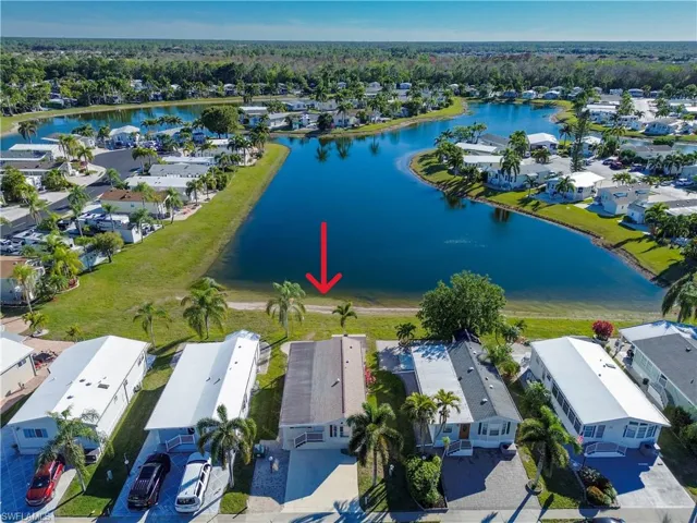 Aerial view of residential area with a large body of water