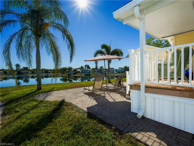 View of patio featuring a water view and a residential view