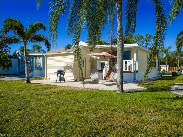 Back of house with a patio