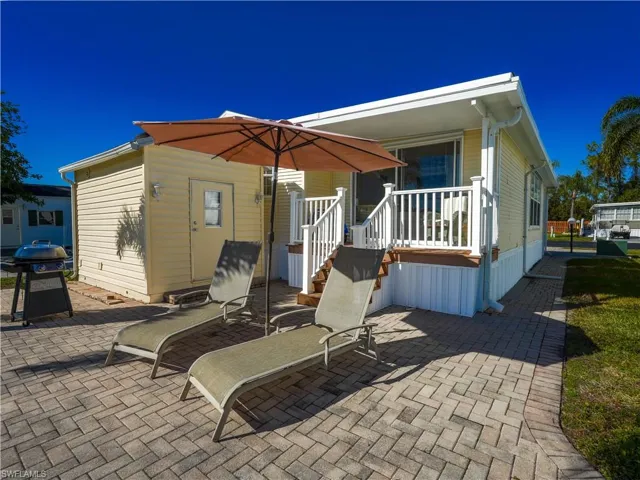 Back of house with a patio area