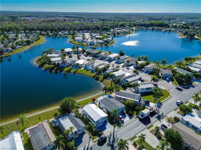 Aerial perspective of suburban area with a nearby body of water