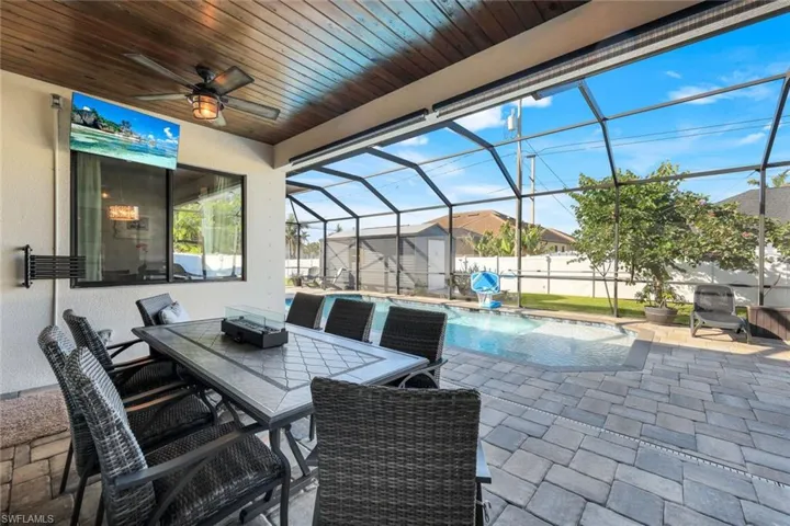 Under-cover lanai seating with wood ceiling