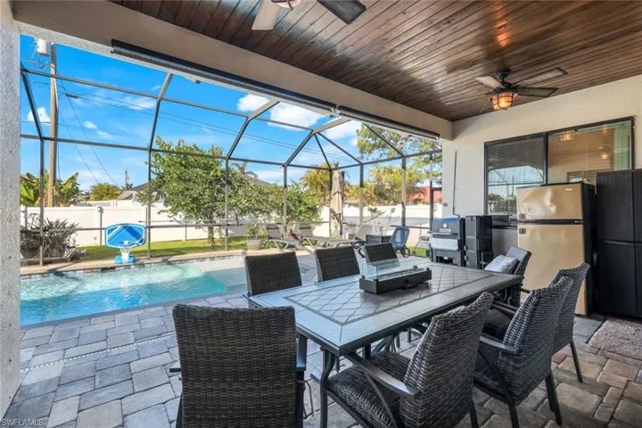 Under cover lanai seating area with wood ceiling