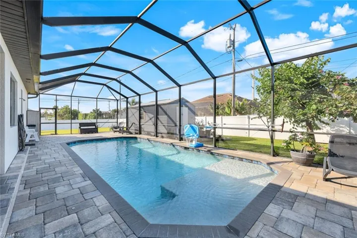 View of pool with Baja sun ledge