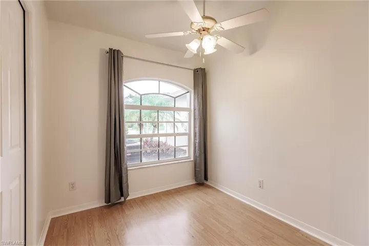 Spare room featuring ceiling fan and light hardwood / wood-style flooring