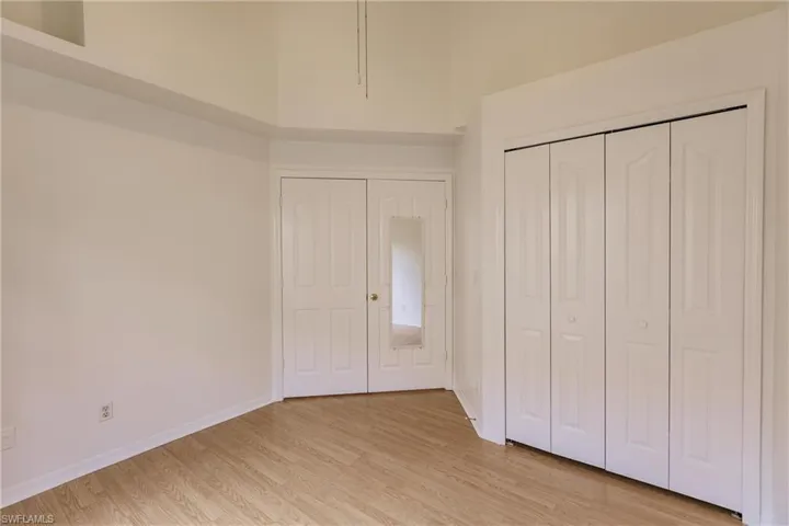 Unfurnished bedroom with a closet and light hardwood / wood-style floors
