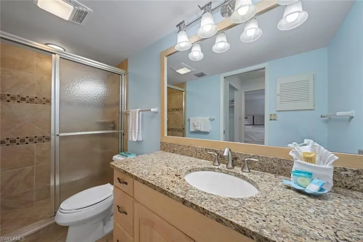 Bathroom with vanity and a stall shower