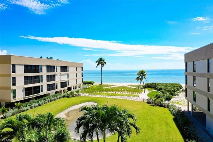 Surrounding community featuring a yard and a water view