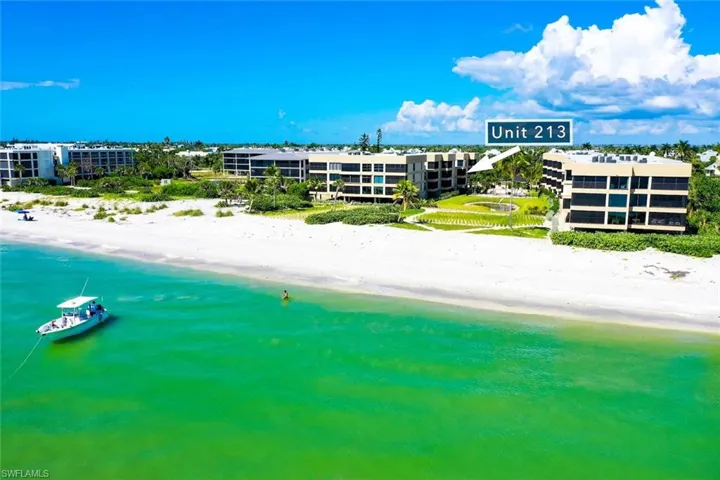 Bird's eye view of waterfront with a beach