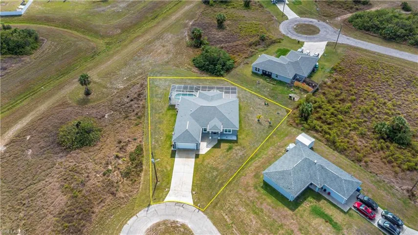 Aerial overview of property's location with property parcel outlined