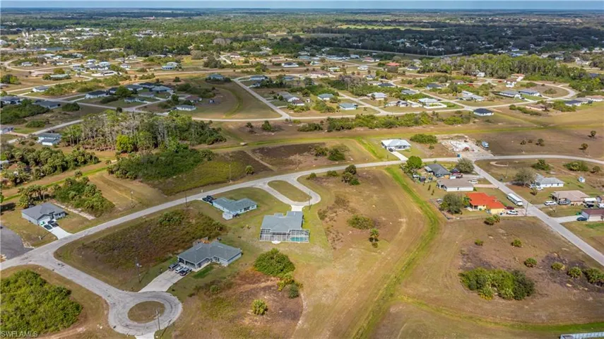 View of property location with nearby suburban area