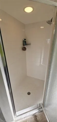 Bathroom featuring tiled shower