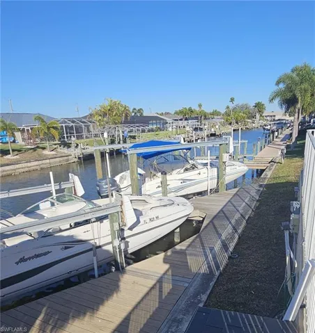Dock with a water view and boat lift