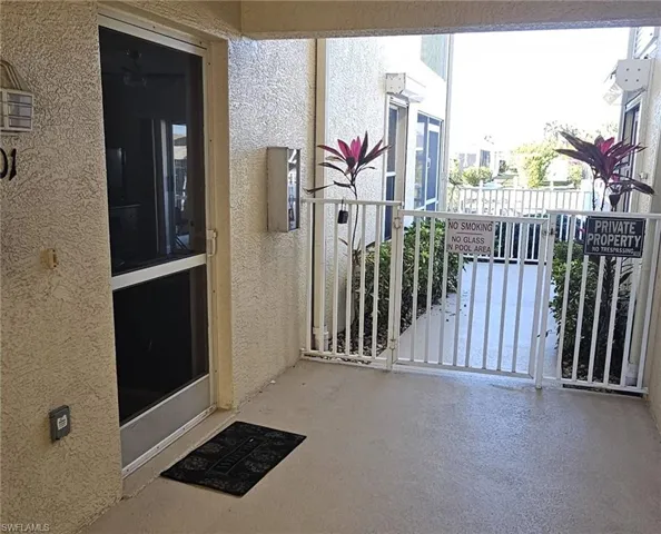 View of exterior entry with stucco siding
