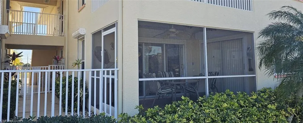 View of property exterior featuring stucco siding and a balcony