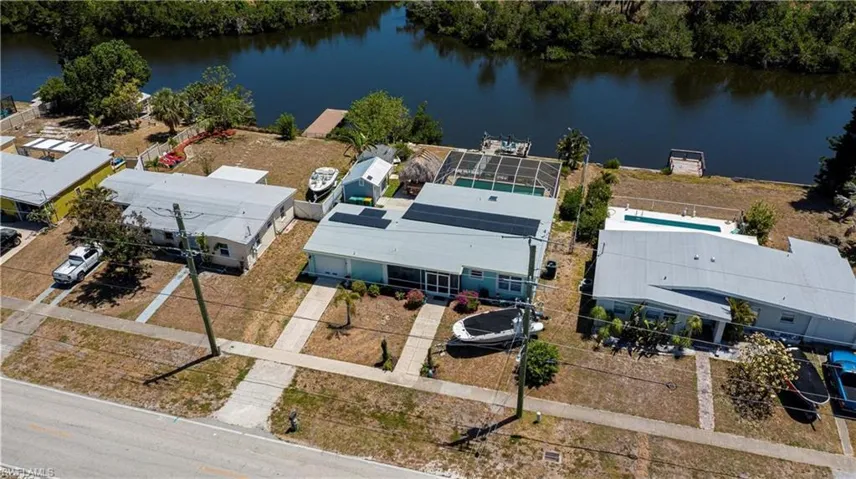 Aerial perspective of suburban area with a large body of water