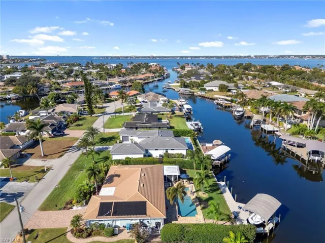View of property location with a large body of water and nearby suburban area