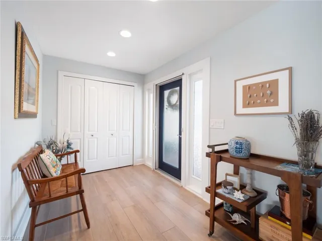 Foyer featuring light wood-style flooring and recessed lighting