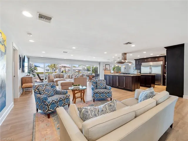 Living room featuring light wood-style floors and recessed lighting