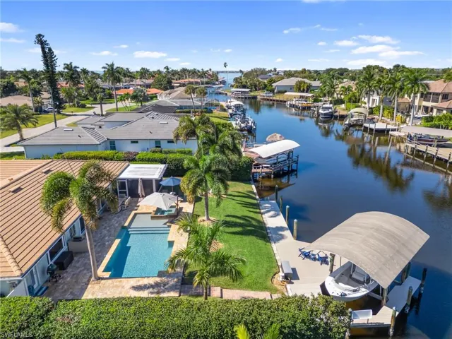 Aerial perspective of suburban area with a large body of water