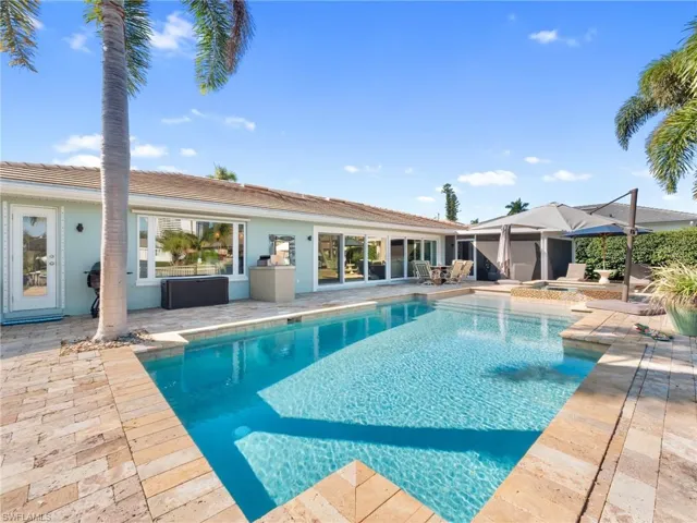 Swimming pool with a patio