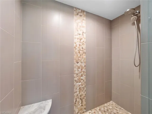 Full bathroom featuring a tile shower