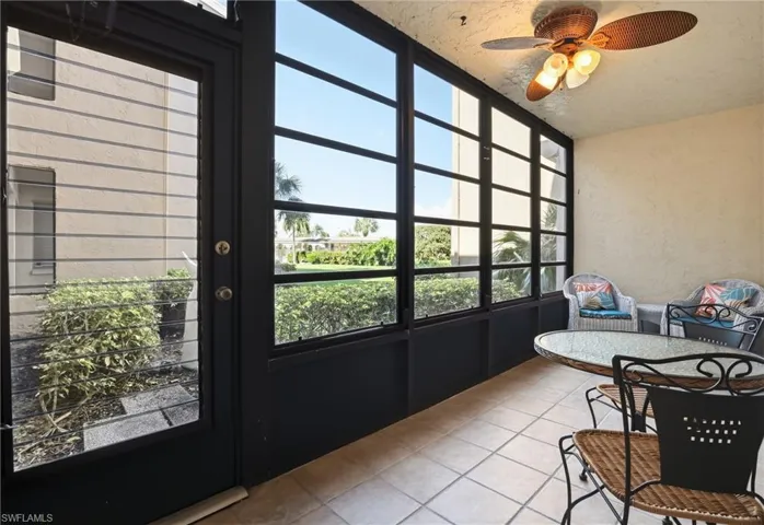 Sunroom / solarium featuring tile patterned floors